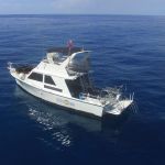 Purpose built scuba diving boat anchored on a dive site in Kauai