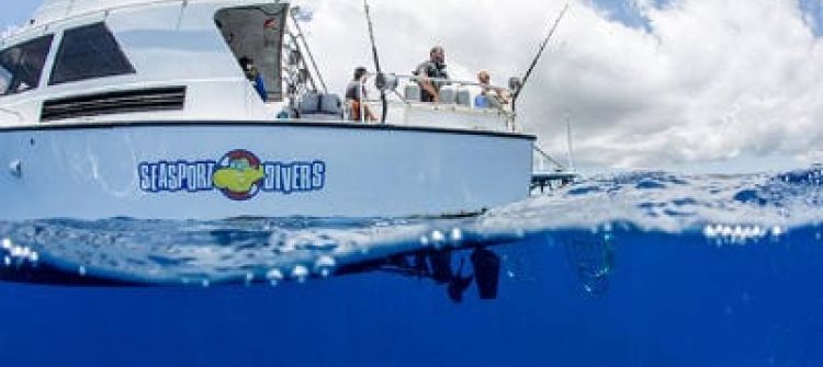 Scuba diving boat in very clear waters in Kauai