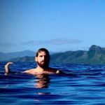 Diver swimming at the surface in kauai after scuba diving